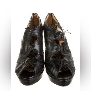 Prada Black Leather cutout Platform pumps
Barely worn.. very vintage